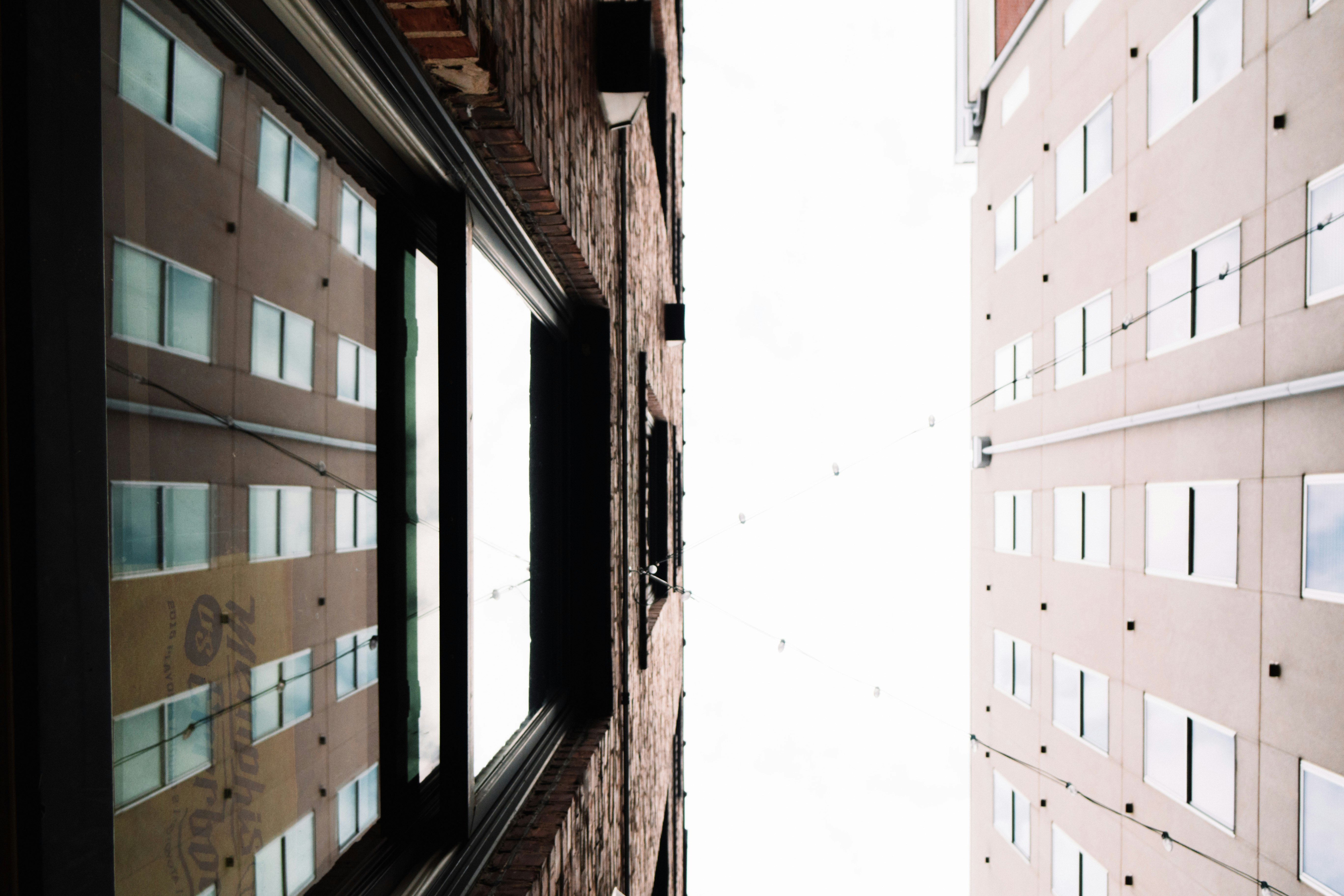 low angle photography of two high-rise buildings